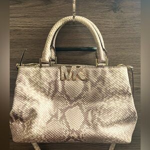Michael Kors purse. Snakeskin pattern. Shoulder strap included.